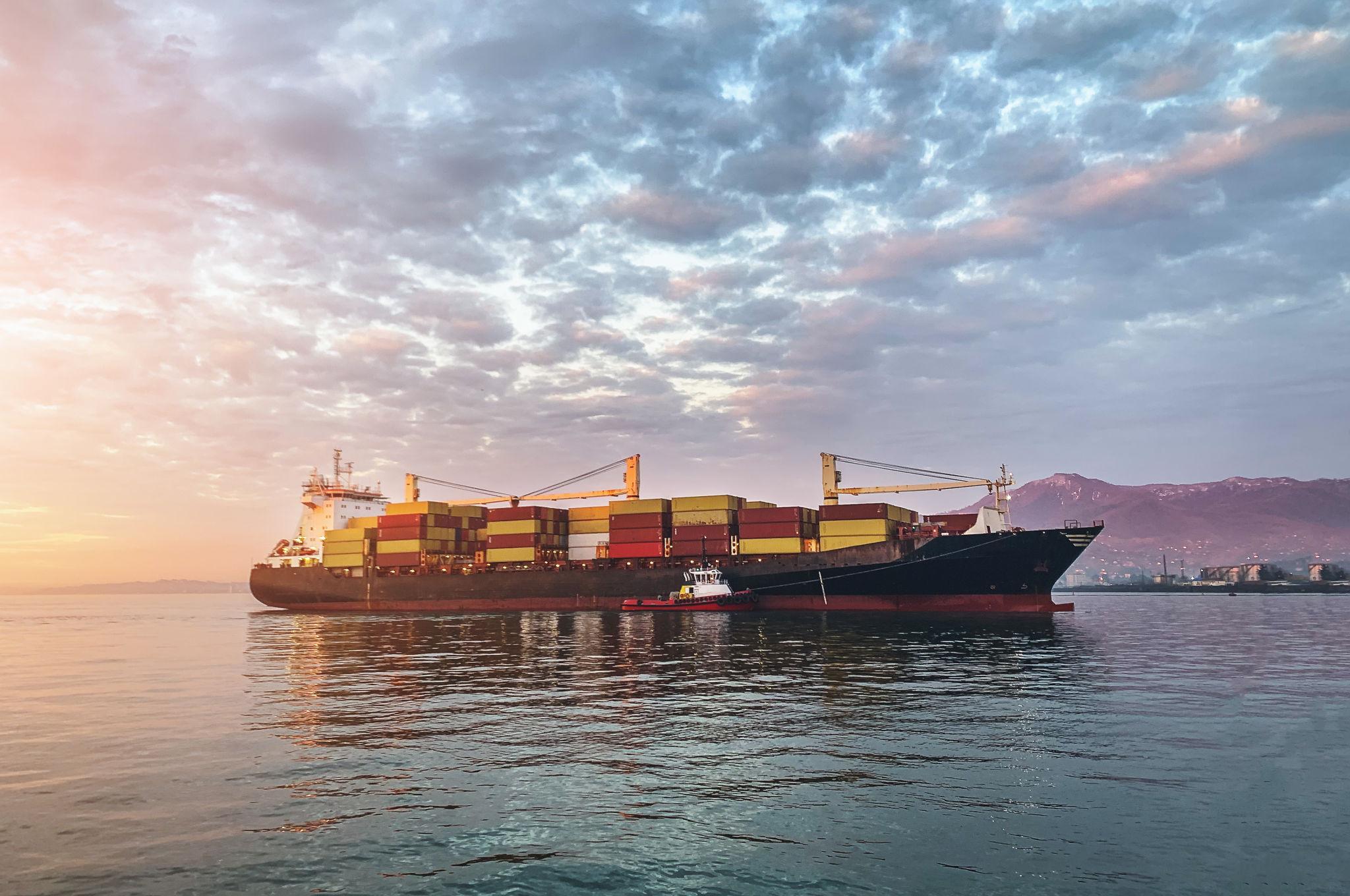 Cargo ship loaded with export containers at port